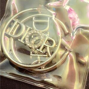 GWP Dior Shimmering Gold Logo Pin